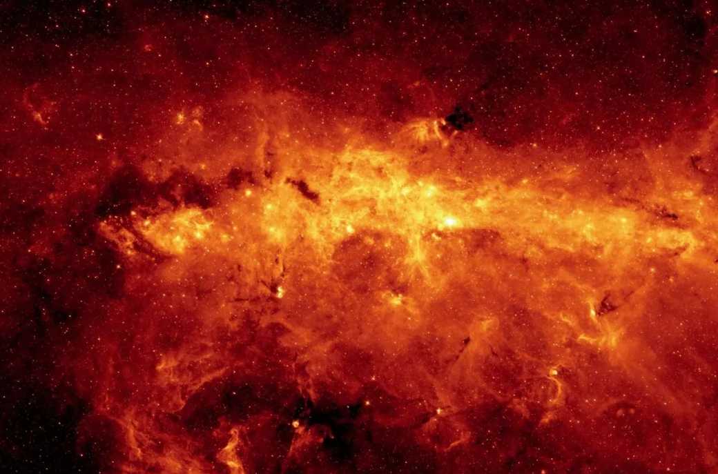 Spitzer's Infrared Glimpse into the Heart of the Milky Way